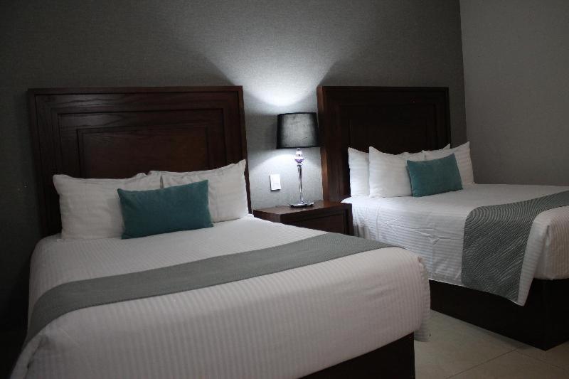 Hotel Suites Mexico Plaza Leon Campestre León Quarto foto